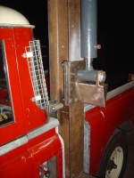  can see end of locking pin holding the beam up vertically